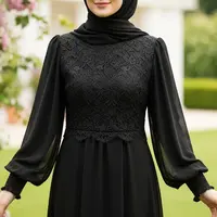 Gamis Brokat Hitam Lengan Balon/Model Gamis Brokat Hitam Elegan (Sumber: gemini.com)