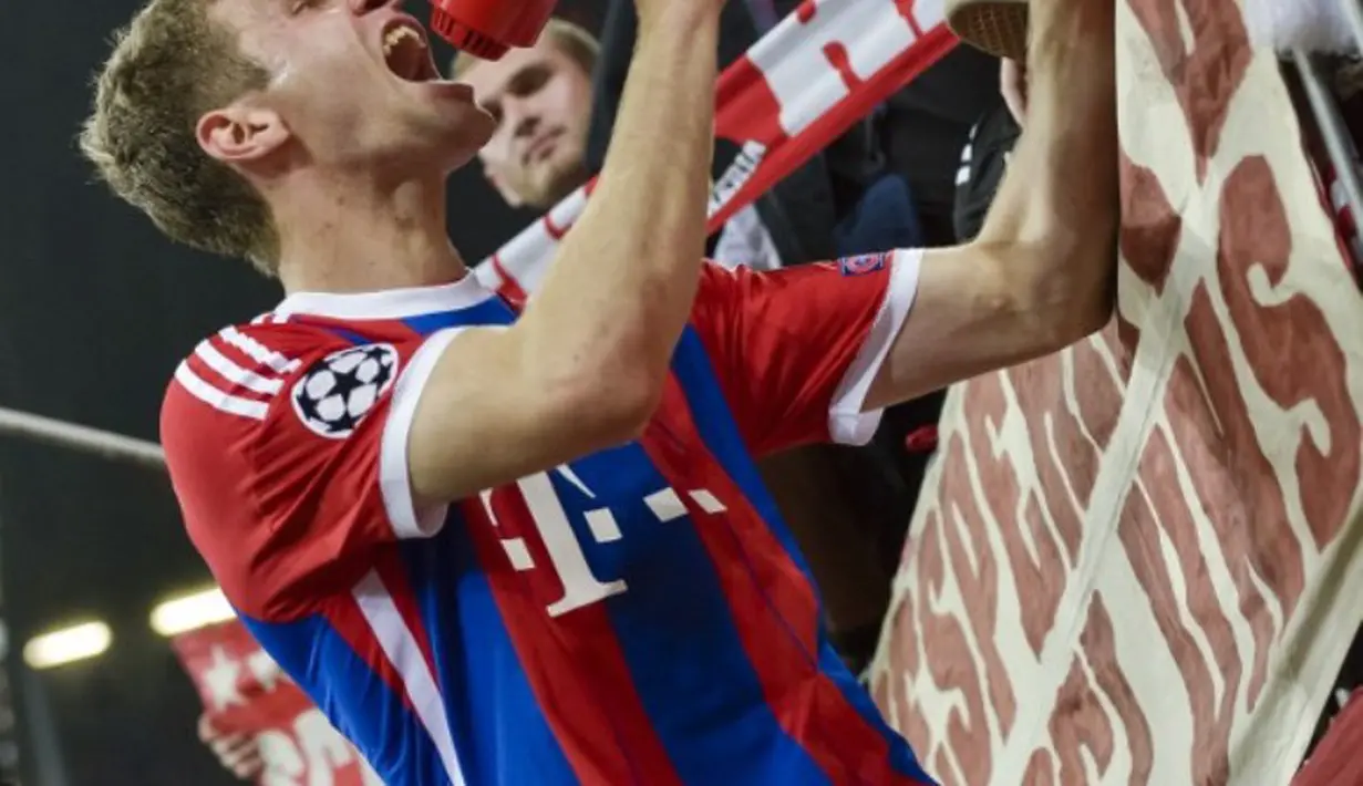 Terlihat kharisma Thomas Mueller (GUENTER SCHIFFMANN / AFP )