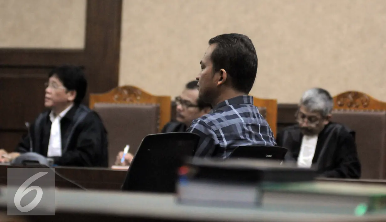 Marudut dinyatakan terbukti menyuap Kepala Kejaksaan Tinggi DKI Jakarta Sudung Situmorang dan Asisten Pidana Khusus Kejati DKI Tomo Sitepu, Pengadilan Tipikor Jakarta, Jumat (2/9). (Liputan6.com/Helmi Afandi)