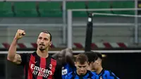 Ekspresi striker AC Milan, Zlatan Ibrahimovic, setelah menjebol gawang Inter Milan pada laga Liga Italia di Giuseppe Meazza, Sabtu (17/10/2020). (AFP/Miguel Medina)