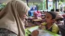 Kegiatan pesantren kilat di Ruang Publik Terpadu Ramah Anak (RPTRA) Malinjo, Jakarta, diadakan sampai dengan tanggal 14 Ramadan. (Liputan6.com/Angga Yuniar)