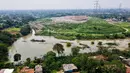 Banjir di di Kampung Bulak, Cipayung, Jawa Barat juga imbas melubernya sampah dari tempat pembuangan akhir (TPA Cipayung) yang kelebihan beban. (BAY ISMOYO/AFP)