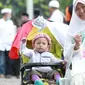 Salah satu peserta aksi damai 212 di kawasan Monas, Jumat 2 Desember 2016. (Foto: Adrian Putra/Bintang.com)