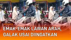 Aksi nekat emak-emak terekam kamera warga. Terjadi di sebuah jalanan yang ramai kendaraan. Emak-emak bermotor memboncengkan anak melawan arus dan berpapasan angkot.