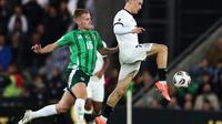 Aksi Florian Wirtz dalam laga Irlandia Utara vs Jerman di Kualifikasi Piala Dunia 2026, Selasa (14/10/2025).&nbsp;(AP Photo/Peter Morrison)