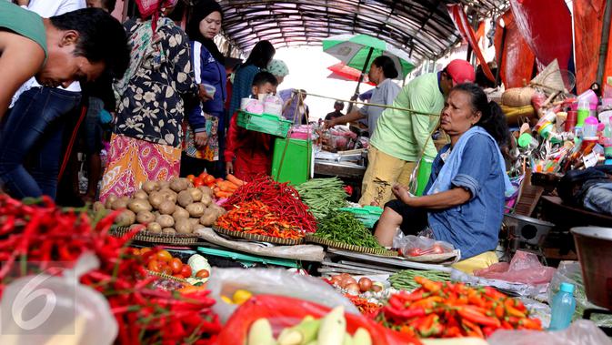 Pedagang sayuran di pasar.