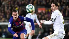 Duel Antoine Griezmann dan Sergio Ramos dalam laga Barcelona vs Real Madrid di Camp Nou (19/12/2019). (AFP/Jose Jordan)
