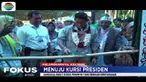 Usai menjalani upacara adat, Sandi dipersilahkan maju dan melipat kain yang diletakkan di atas kayu sebelum menebasnya dengan mandau senjata tradisional khas Kalimantan Tengah.