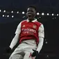 Pemain Arsenal, Eddie Nketiah melakukan selebrasi setelah mencetak gol pembuka timnya ke gawang Manchester United pada laga lanjutan Liga Inggris 2022/2023 yang berlangsung di Emirates Satdium, London, Minggu (23/01/2023). Arsenal berhasil menang dengan skor 3-2 atas Manchester United. (AP Photo/Ian Walton)