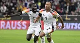 Pemain Jerman, Jamie Leweling (kanan) melakukan selebrasi bersama Antonio Rudiger setelah mencetak gol ke gawang Belanda pada laga lanjutan Grup A3 UEFA Nations League di Allianz Arena, Jerman, Selasa (15/10/2024) dini hari WIB. (AP Photo/dpa/Sven Hoppe)