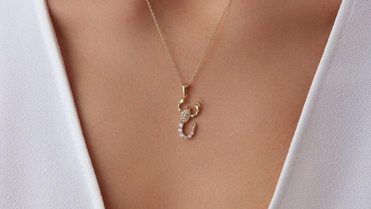 Ilustrasi Kalung Liontin Zodiak Emas