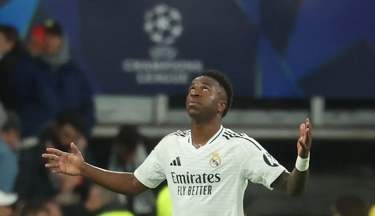 Real Madrid semakin tak terbendung usai dua gol Vinicius Junior, menit ke-55 dan 77, merobek jala gawang RB Salzburg. (Pierre-Philippe MARCOU/AFP)