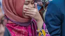 Siti Aisyah tiba di Bandara Halim Perdanakusuma, Jakarta, Senin (11/3). Siti Aisyah kembali ke Indonesia setelah dibebaskan oleh Pengadilan Tinggi Shah Alam terkait kasus dugaan pembunuhan Kim Jong-Nam. (Liputan6.com/Faizal Fanani)