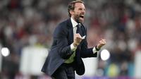 Gareth Southgate merupakan mantan pemain Crystal Palace, Aston Villa, dan Middlesbrough. Dirinya ditunjuk sebagai juru taktik Timnas Inggris pada tahun 2016 silam dan sukses mengantarkan The Three Lions menembus partai semifinal Piala Dunia 2018 dan final Euro 2020. (Foto: AFP/Pool/Frank Augstein)