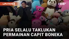 Aksi seorang pria tidak pernah gagal ketika bermain capit boneka menarik perhatian