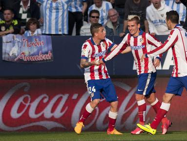Selebrasi  Antoine Griezmann setelah sepakannya dari jarak dekat menghujam deras gawang Malaga yang dikawal Carlos Kameni.