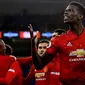 Gelandang Manchester United, Paul Pogba, berhasil mencetak dua gol dan satu assist sekaligus membantu timnya menang 4-1 atas Bournemouth di Old Trafford, pada laga pekan ke-20 Premier League, Minggu (30/12/2018). (AP Photo/ Jon Super)