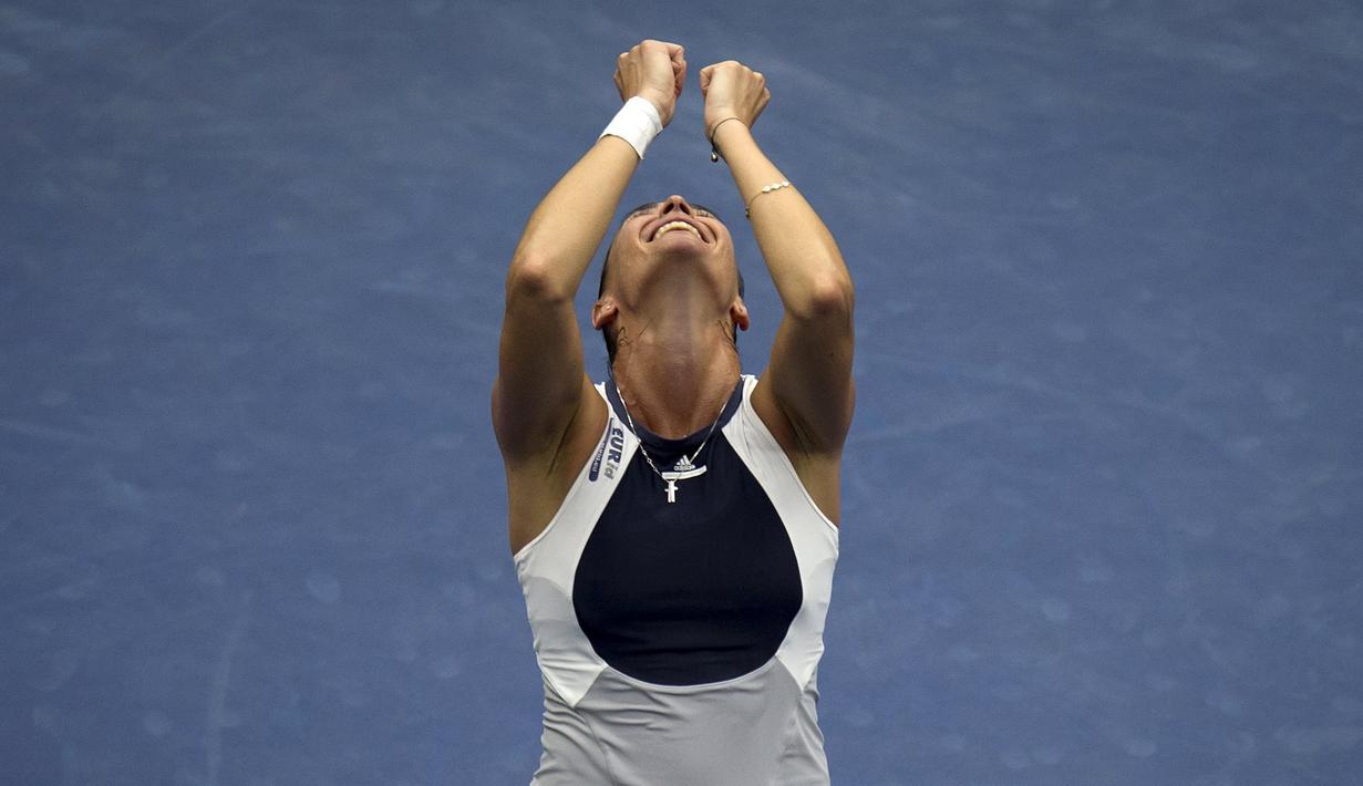 Ekspresi petenis Italia, Flavia Pennetta, sesaat setelah menjuarai Tenis AS Terbuka 2015 di New York, AS. (13/9/2015). (Reuters/Carlo Allegri)