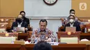 Ketua Komisi Pemberantasan Korupsi (KPK) Firli Bahuri (tengah) saat mengikuti rapat kerja dengan Komisi III DPR di Jakarta, Rabu (8/6/2022). Rapat yang berlangsung tertutup tersebut membahas RKA K/L Tahun 2023. (Liputan6.com/Angga Yuniar)