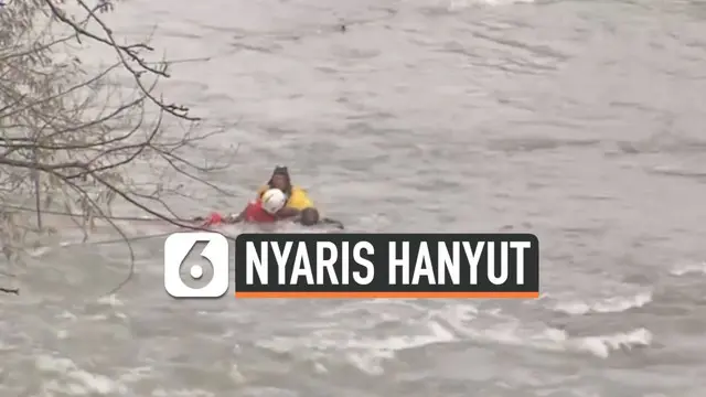 Seorang pria terjebak di derasnya sungai air terjun Niagara. Beruntung petugas keselamatan berhasil menariknya ke tepi sungai.