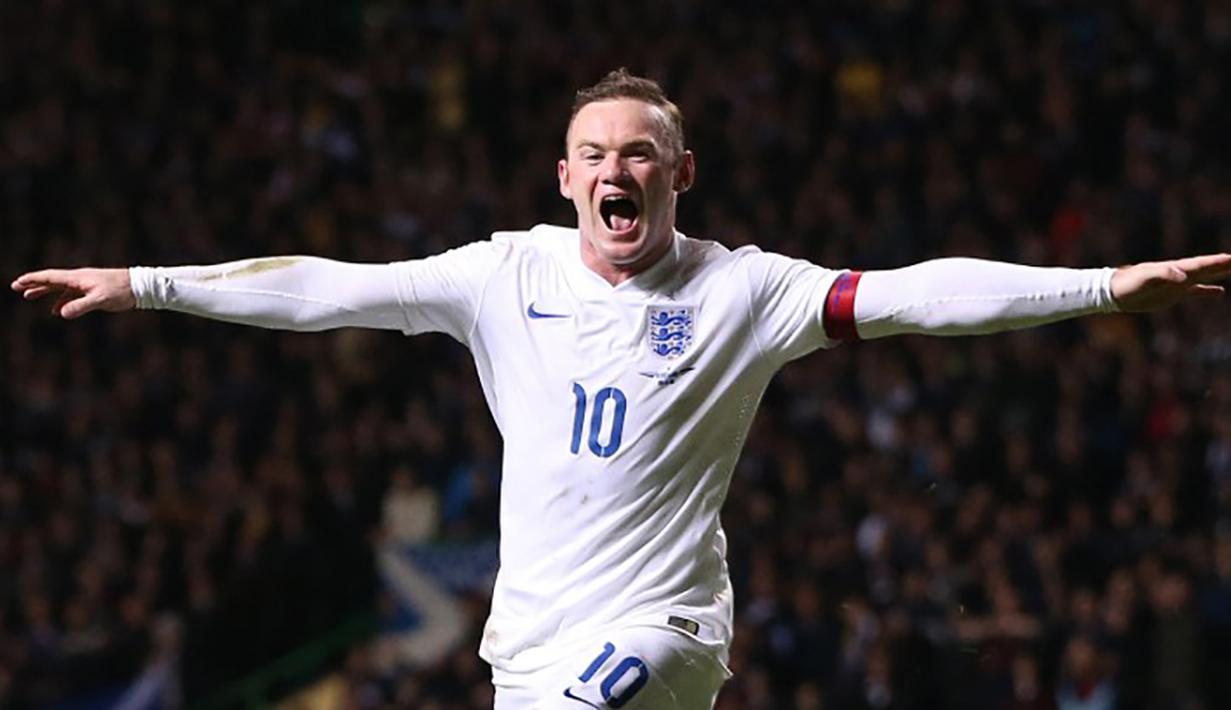Wayne Rooney merayakan gol ke gawang Skotlandia pada laga persahabatan di Stadion Celtic Park, Skotlandia, Selasa (18/11/2014). (AFP Photo/Ian Macnicol)