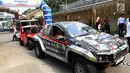 Tim Jambore Kendaraan Listrik Nasional finish di Kantor PLN UID Jakarta Raya, Selasa (3/9/2019). Jambore nasional yang digelar oleh Institut Teknologi Sepuluh Nopember (ITS) tersebut berbentuk rally dan menempuh jarak 900 kilometer (km) dari Surabaya menuju Jakarta. (Liputan6.com/Johan Tallo)