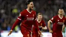 Ekspresi pemain Liverpool, Emre Can saat melakukan selebrasi usai membobol gawang Huddersfield Town pada lanjutan Premier League di John Smith's Stadium, Huddersfield, (30/1/2018). Liverpool menang 3-0. (Martin Rickett/PA via AP)