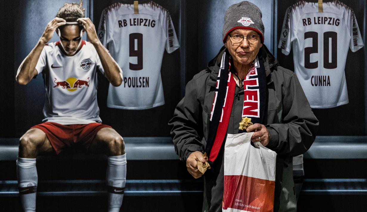 Leipzig fan in front of RB Leipzig advertising during the Bundesliga match between RB Leipzig and Borussia Mˆnchengladbach at Red Bull Arena on February 1, 2020 in Leipzig, Germany. (Photo by Boris Streubel/Bundesliga/Bundesliga Collection via Getty Images)