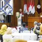 Plt Kepala Perpusnas E Aminudin Azis saat menjadi pembicara di Seminar Nasional Silahturami Perpustakaan Perguruan Tinggi Muhammadiyah Aisyiyah (Silasma) 2024. (Liputan6.com/ Dok Ist)