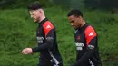 Bertandang ke markas Real Madrid, Arsenal tampil percaya diri dengan bekal kemenangan telak 3-0 di leg pertama. (Adrian Dennis/AFP)