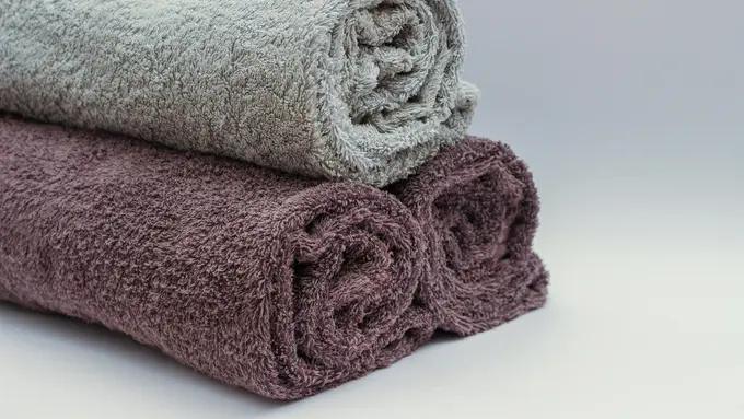 mencuci handuk cover