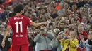Pemain Liverpool Mohamed Salah memberi isyarat kepada para penggemar saat dia digantikan ketika melawan AC Milan pada pertandingan Grup B Liga Champions di Anfield, Liverpool, Inggris, Rabu (15/9/2021). Liverpool menang 3-2. (AP Photo/Rui Vieira)