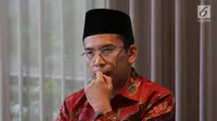 Ekspresi mantan Gubernur Nusa Tenggara Barat (NTB), TGB Muhammad Zainul Majdi saat konferensi pers klarifikasi pemberitaan di Jakarta, Rabu (19/9). TGB diduga menerima gratifikasi terkait saham PT Newmont Nusa Tenggara. (Merdeka.com/Imam Buhori)