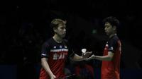 Ganda putra Indonesia, Kevin Sanjaya/Marcus Gideon, merayakan kemenangan atas wakil India, Satwiksairaj Rankireddy/Chirag Shetty, pada Indonesia Open 2019 di Istora, Jakarta, Kamis (17/7). Kevin/Marcus menang 21-15, 21-14. (Bola.com/Yoppy Renato)