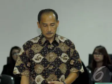 Eks Deputi Gubernur Bank Indonesia Budi Mulya mengaku sedih dan kecewa di PN Tipikor, Jaksel, Rabu (16/7/2014) (Liputan6.com/Miftahul Hayat)