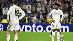 Kalah 1-2 pada leg kedua perempat final Liga Champions 2024/2025 memastikan Los Blancos tersingkir dari kompetisi Liga Champions 2024/2025. (JAVIER SORIANO/AFP)