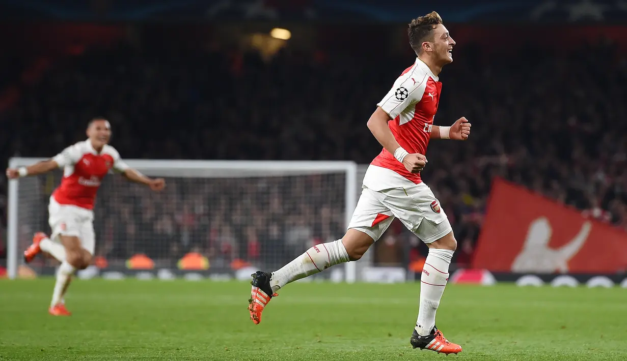 Ekspresi Mesut Ozil setelah mencetak gol ke gawang Munchen dalam lanjutan Grup F Liga Champions di Stadion Emirates, London, Rabu (21/10/2015) dini hari WIB. (EPA/Andy Rain) 