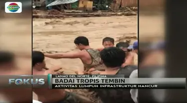 Sebanyak 75 orang di Filipina tewas akibat diterjang Badai Tropis 'Tembin', evakuasi warga dari arus deras berjalan dramatis.