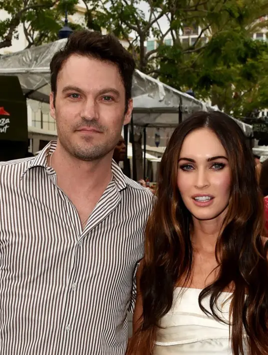 Megan Fox dan Brian Austin Green menghadiri pemutaran perdana film Teenage Mutant Ninja Turtle di California. Foto diambil 3 Agustus 2014. Pasangan beda usia 13 tahun itu memutuskan bercerai setelah lima tahun menikah.(Kevin Musim Dingin/Getty Images/AFP)