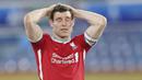 Gelandang Liverpool, James Milner, tampak kecewa usai gagal mengalahkan Leeds United pada laga Liga Inggris di Stadion Elland Road, Senin (19/4/2021). Kedua tim bermain imbang 1-1. (Clive Brunskill/Pool via AP)