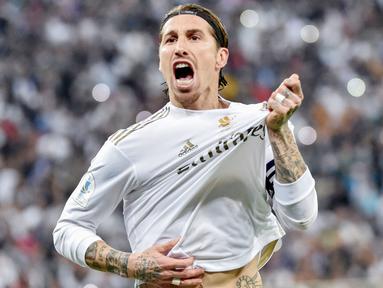 Real Madrid pada akhirnya mengambil keputusan berat terkait masa depan bek sekaligus kaptennya, Sergio Ramos. Mereka memastikan sang pemain tidak akan mengenakan seragam kebanggaan Los Merengues musim depan. (AFP/Fayez Nureldine)