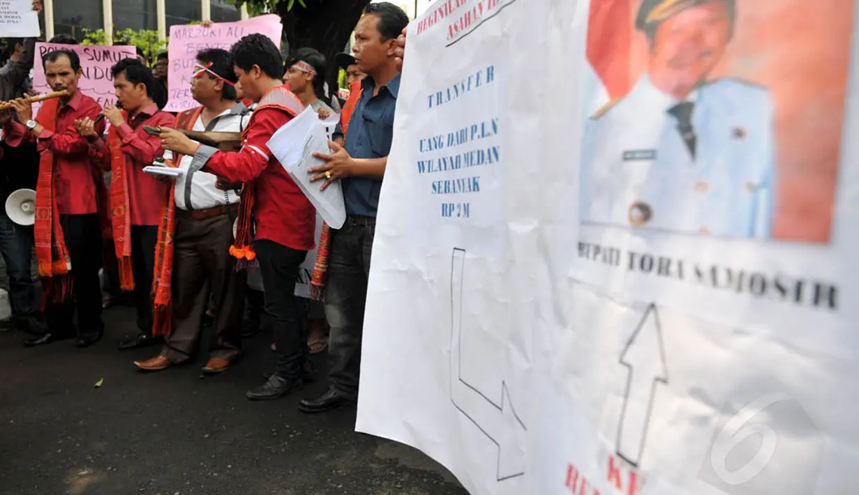 Kasmin Simanjuntak yang juga Ketua DPC Partai Demokrat Kabupaten Toba Samosir sudah ditetapkan sebagai tersangka dalam kasus tindak pidana korupsi pada pembangunan PLTA Asahan III. Namun, hingga kini belum ditahan. (Liputan6.com/Johan Tallo)