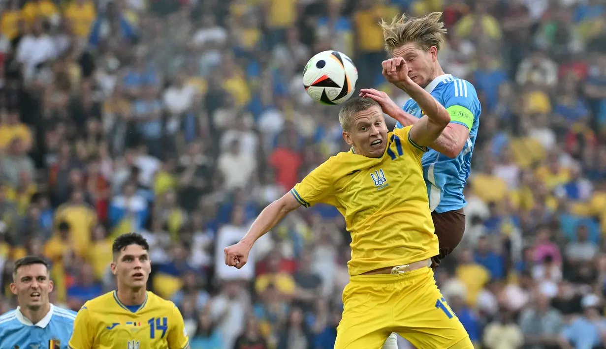 Tambahan satu poin ini membuat Belgia dan Ukraina sama-sama mengoleksi empat poin. (MIGUEL MEDINA / AFP)