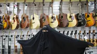 Perkenakan Marie, Wanita Gitaris Band Metal Pemakai Burqa
