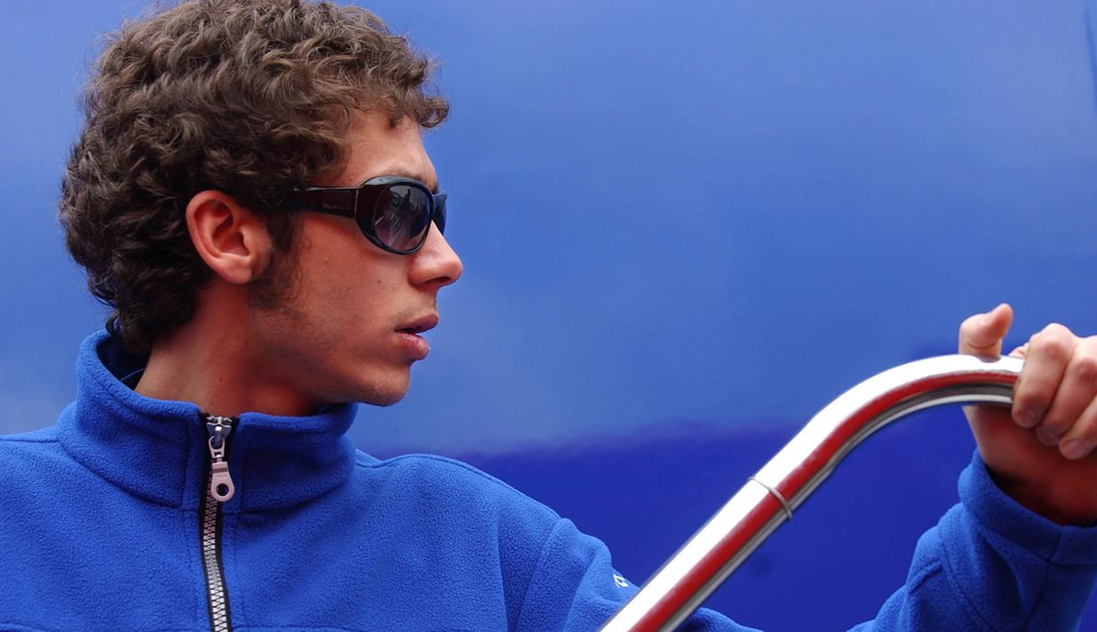 Pebalap Italia, Valentino Rossi dengan rambut ikal pendek. (AFP/Cristina Quicler)