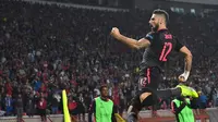 Penyerang Arsenal, Olivier Giroud melakukan selebrasi usai menjebol jala Crvena Zvezda, pada Matchday 3 Liga Europa 2017-2017, di Belgrade, Jumat (20/10/2017) dini hari WIB.  Arsenal unggul 1-0 atas tuan rumah. (AFP/Andrej Isakovic)