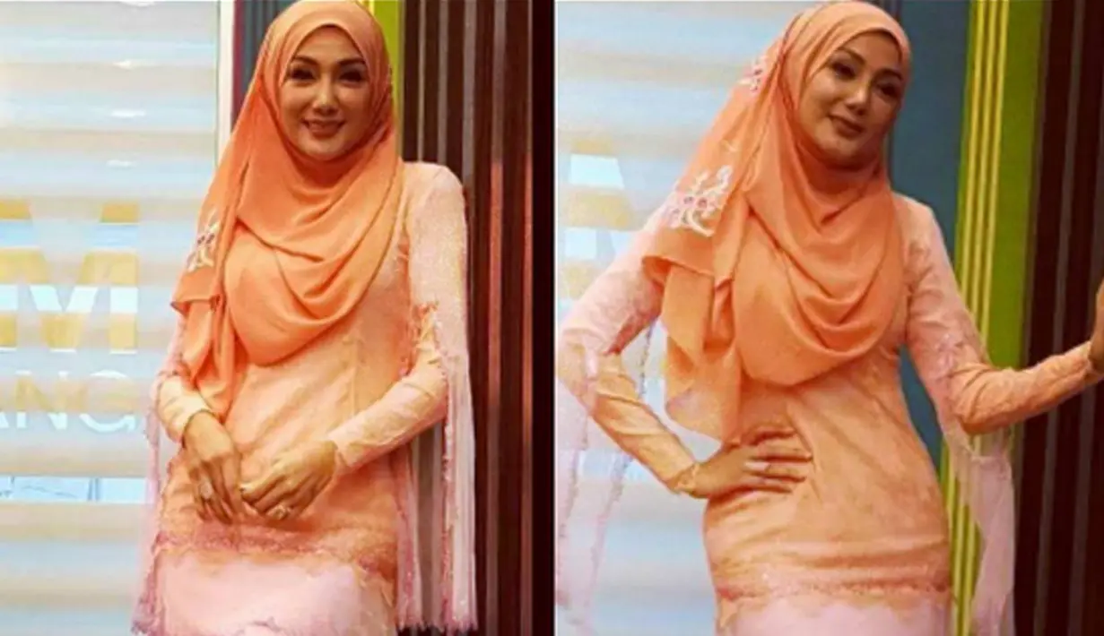 Mantan istri Engku Emran, Erra Fariza berpose saat sesi foto. Erra diketahui sudah membintangi puluhan judul film, dan memiliki beberapa album lagu. (instagram/errafazira) 