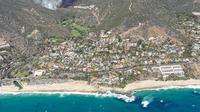 Laguna Beach Mayor Alex Rounaghi announced the primary cause of the Laguna Beach fire. This statement was based on preliminary evidence and reports from officers on the ground.