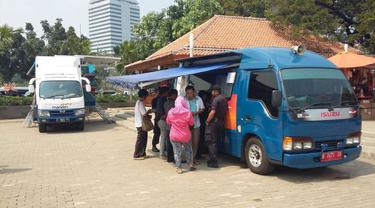 Mobil Penukaran Uang BI di Lapangan Lenggang Jakarta, Monas, Jakarta Pusat.  