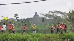 Peserta mengikuti Borobudur Marathon 2018 di Pelataran Taman Lumbini Borobudur Magelang, Minggu (18/11). Peserta Marathon terbagi 3 kategori, yakni Full Marathon 2.883 orang, Half Marathon 3.888 orang dan 10K sebanyak 2.901 orang. (Liputan6.com/Gholib)